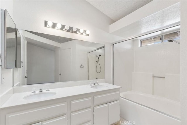 bathroom featuring a textured ceiling and vanity