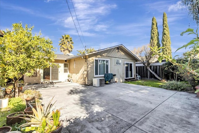 rear view of property featuring a patio area