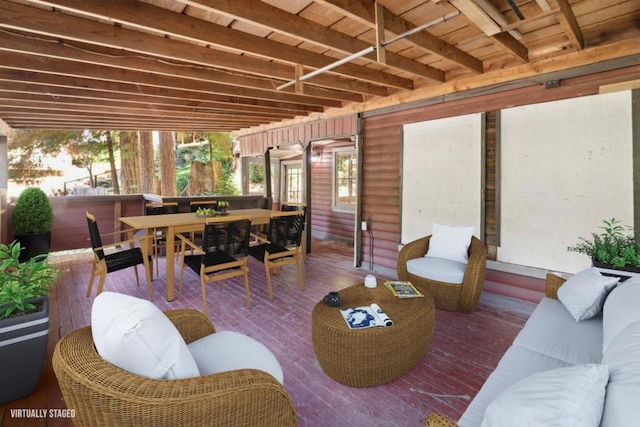 interior space featuring a jacuzzi, an outdoor hangout area, and a deck