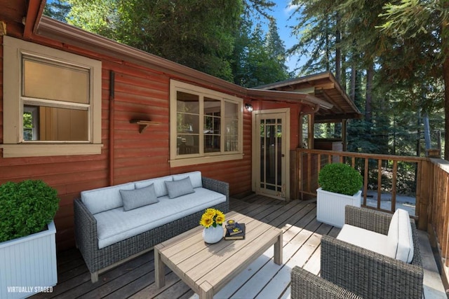 wooden deck featuring an outdoor hangout area