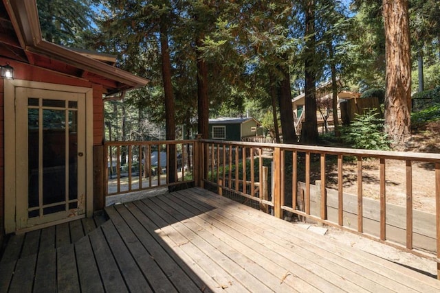 wooden deck with a storage unit