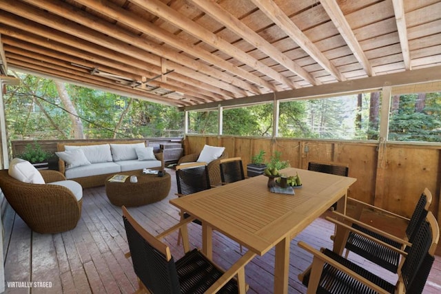 wooden terrace with an outdoor hangout area