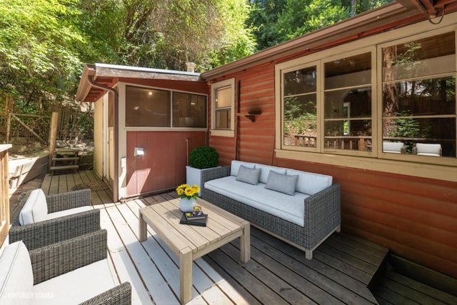 wooden deck featuring outdoor lounge area