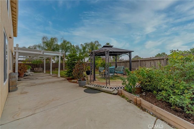 view of patio / terrace with a gazebo and a pergola