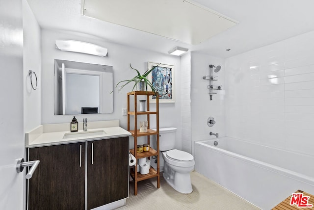 full bathroom featuring tiled shower / bath combo, toilet, and vanity