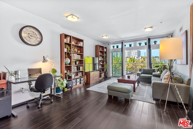 office area with wood-type flooring and a wall of windows