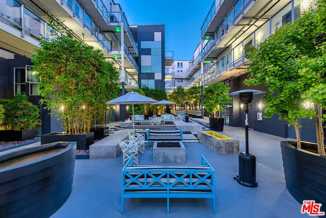 view of home's community featuring an outdoor fire pit