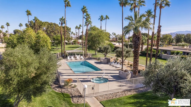 view of swimming pool with a mountain view, a pergola, and a patio