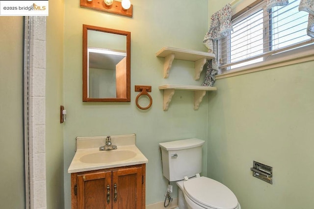 bathroom with toilet and vanity