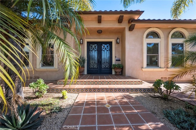 property entrance featuring french doors