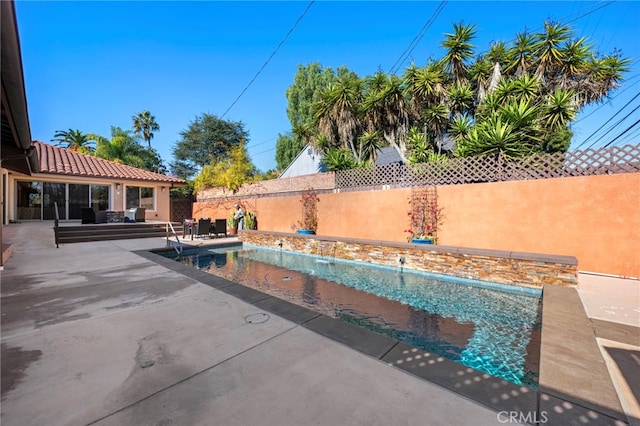 view of pool featuring a patio