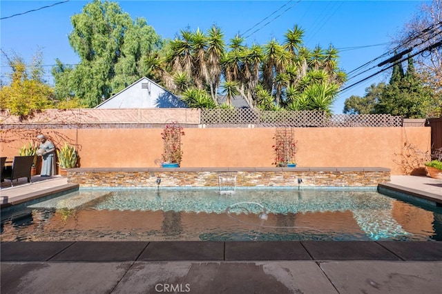 view of swimming pool featuring pool water feature