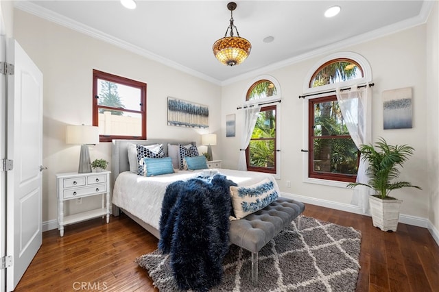 bedroom with dark wood-type flooring and ornamental molding