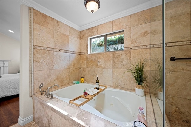 bathroom featuring crown molding and tiled bath