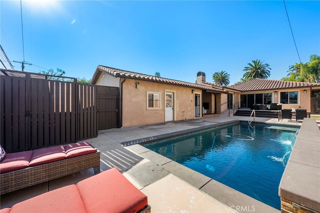 view of swimming pool with a patio and an outdoor hangout area