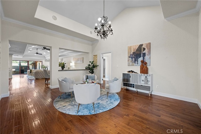 interior space with ornamental molding, ceiling fan with notable chandelier, and dark hardwood / wood-style flooring