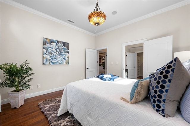 bedroom with dark hardwood / wood-style flooring and ornamental molding