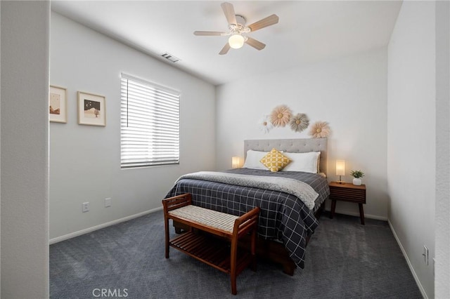 bedroom with a ceiling fan, baseboards, visible vents, and carpet flooring