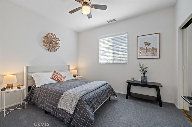 bedroom featuring ceiling fan, visible vents, baseboards, a closet, and carpet