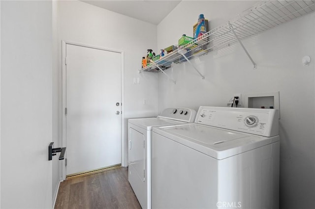 laundry room featuring laundry area, dark wood finished floors, and washing machine and clothes dryer