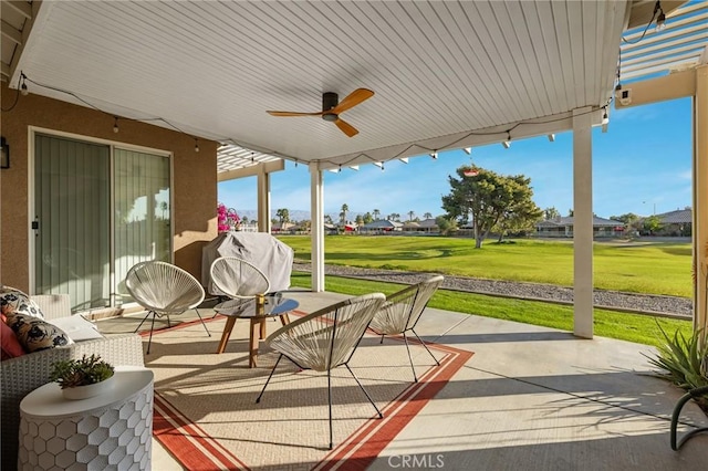 exterior space with a ceiling fan and grilling area