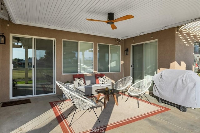 view of patio / terrace with a ceiling fan and a grill