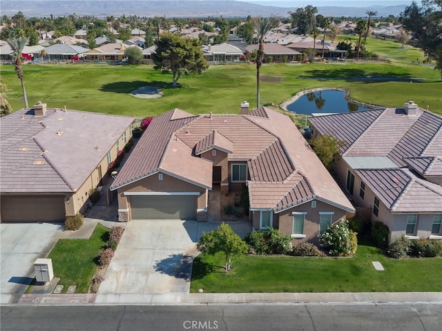 birds eye view of property featuring a water view and a residential view