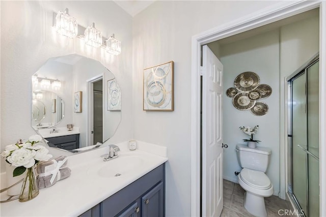 bathroom with a shower with door, toilet, tile patterned flooring, and vanity