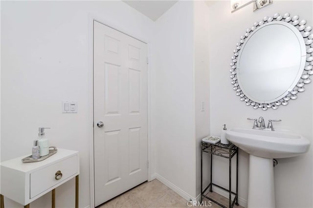 bathroom featuring sink and tile patterned flooring