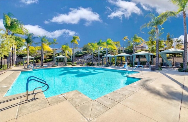 view of pool featuring a patio and a gazebo