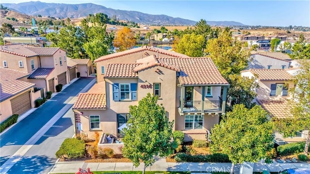 birds eye view of property with a mountain view