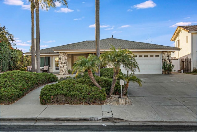 single story home featuring a garage