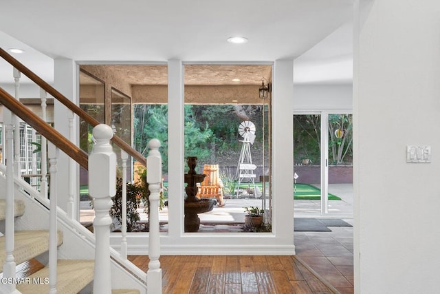 entryway featuring hardwood / wood-style floors and expansive windows