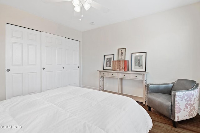 bedroom with a closet, ceiling fan, and dark hardwood / wood-style flooring