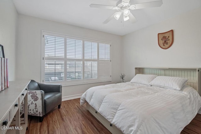 bedroom featuring ceiling fan and dark hardwood / wood-style flooring