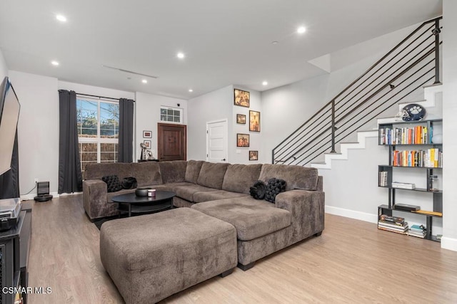 living room with light hardwood / wood-style flooring