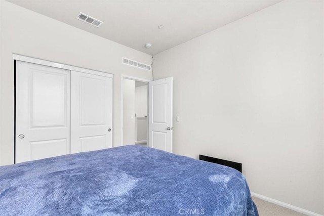 bedroom featuring carpet floors and a closet