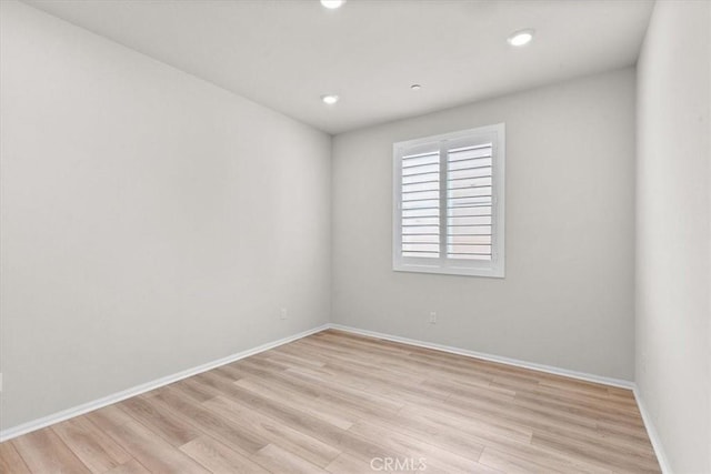 spare room with light wood-type flooring