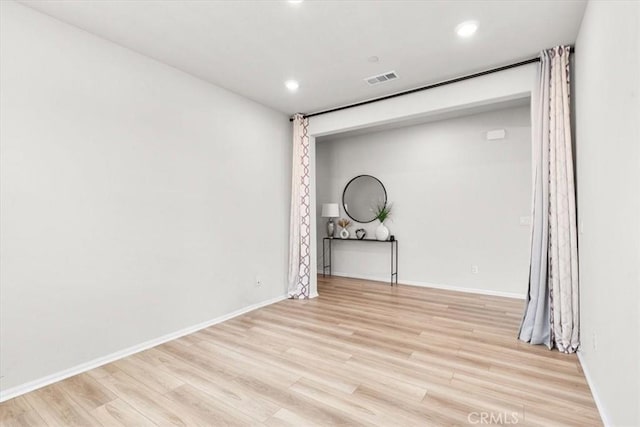 unfurnished room featuring light hardwood / wood-style flooring