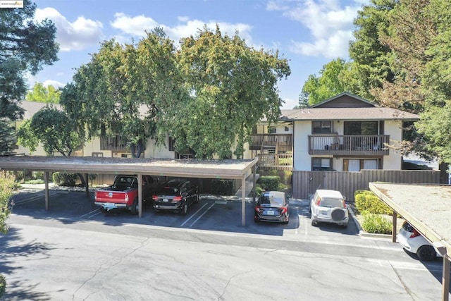 view of parking / parking lot with a carport