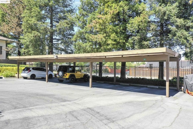 view of parking / parking lot with a carport