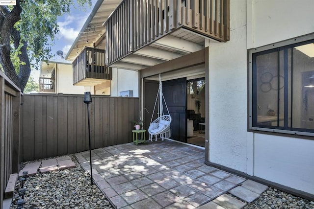 view of patio with a balcony