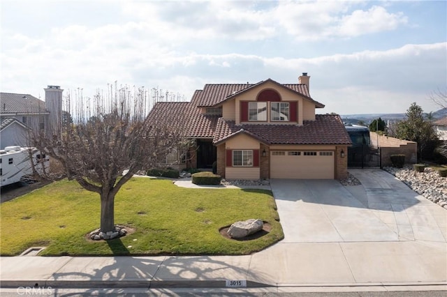 view of property featuring a garage and a front lawn