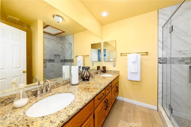 bathroom with vanity and walk in shower