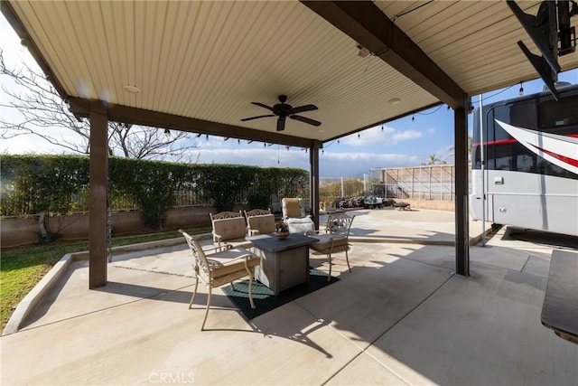 view of patio featuring ceiling fan