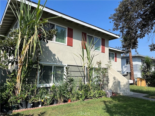 view of property exterior featuring a yard