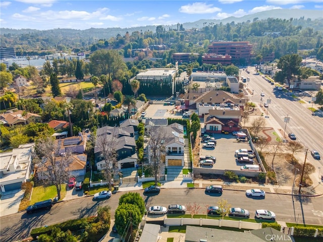 birds eye view of property with a mountain view