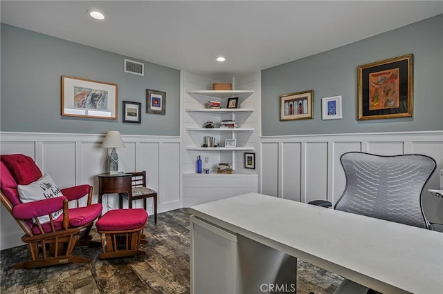 office space with a decorative wall, recessed lighting, visible vents, and a wainscoted wall