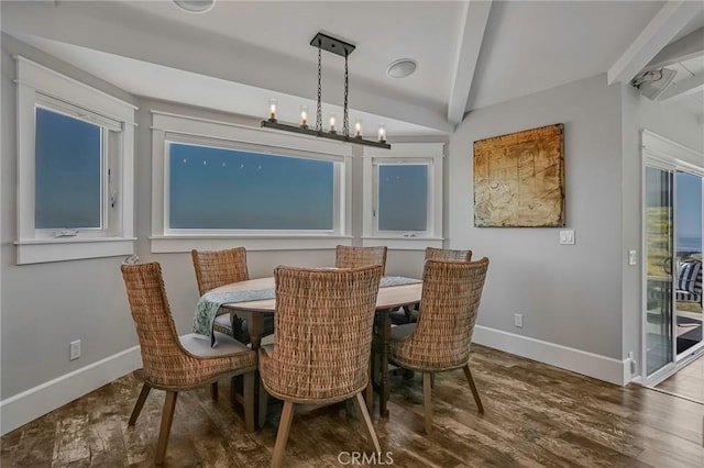 dining room with an inviting chandelier, baseboards, lofted ceiling with beams, and wood finished floors