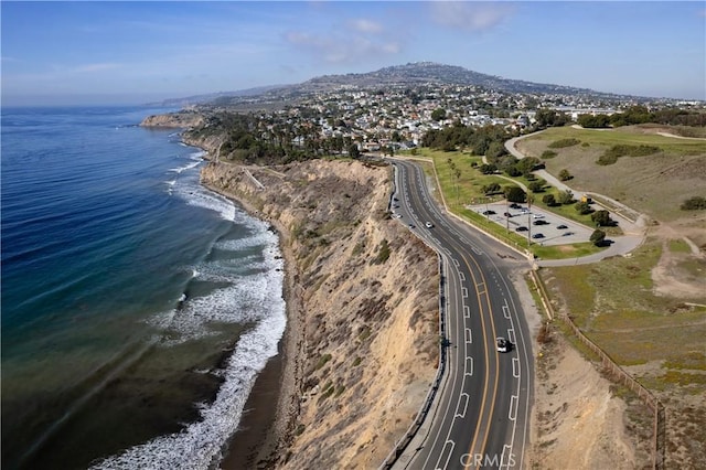 bird's eye view with a beach view and a water and mountain view